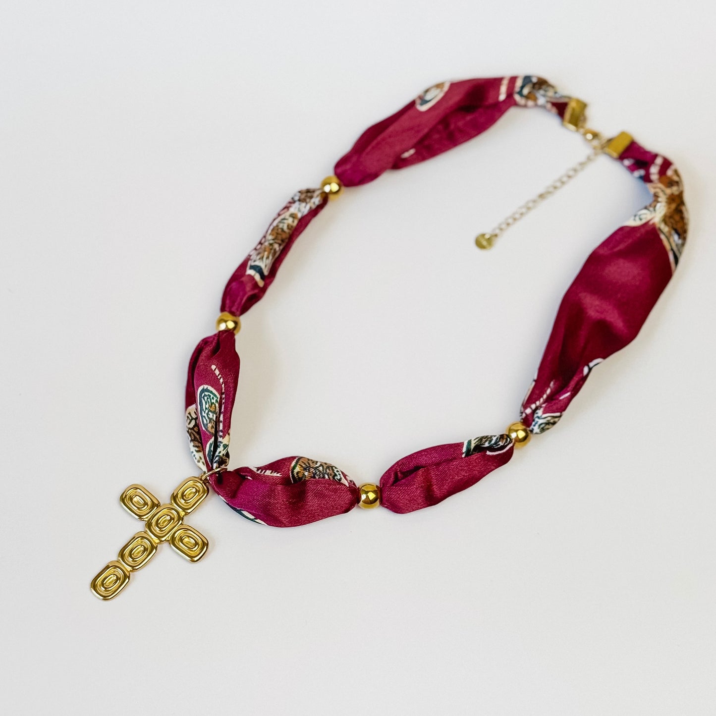Patterned Ribbon Necklace with Gold Cross Pendant