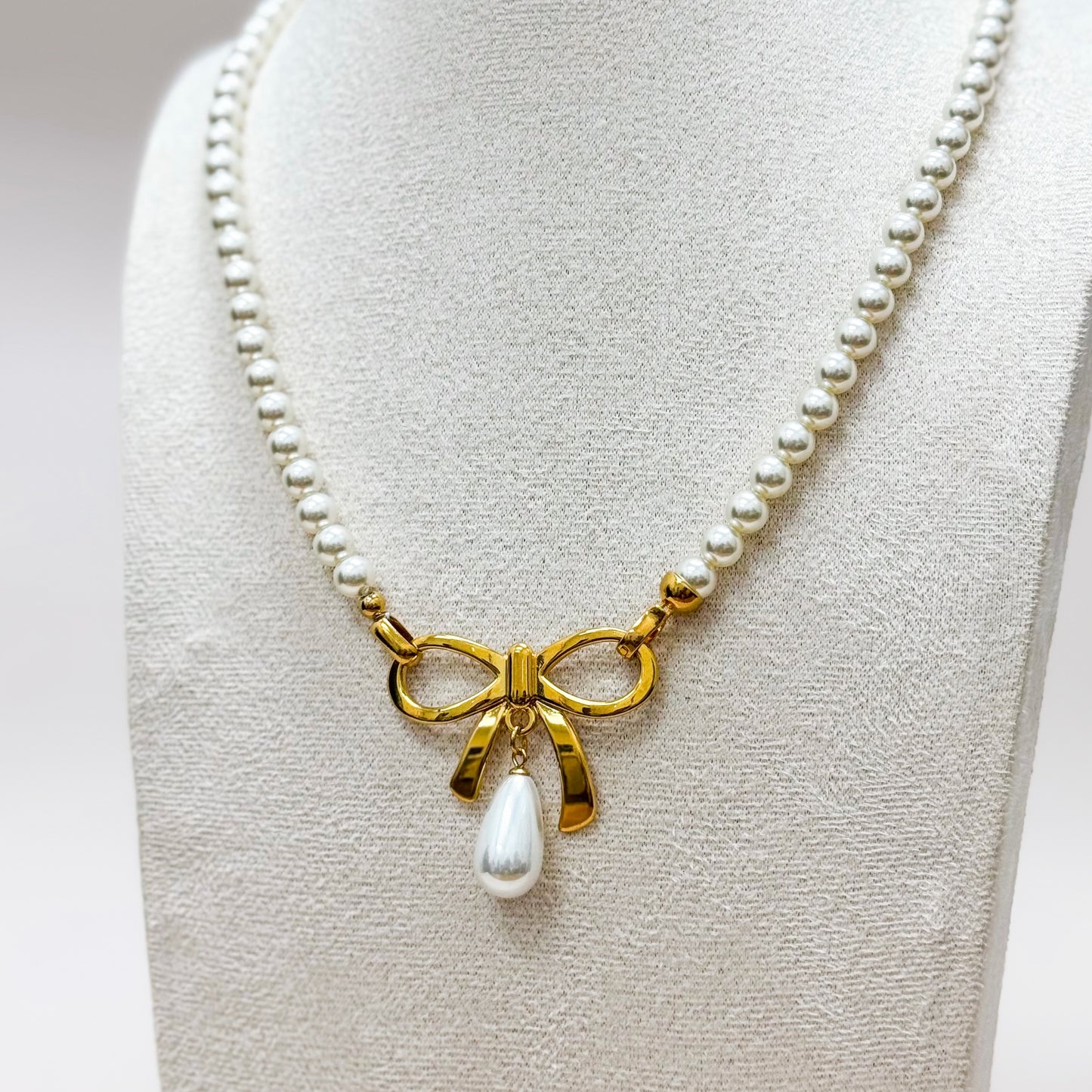 The Colette Bow Necklace – Pearl Strand with Gold Bow & Drop Pearl